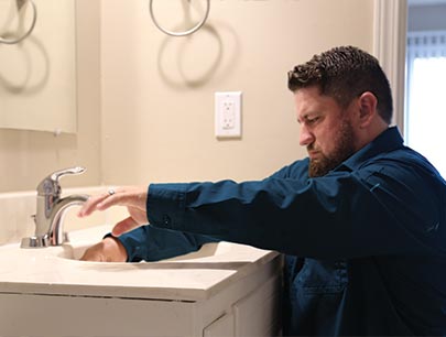 Man Fixing Bathroom Sink