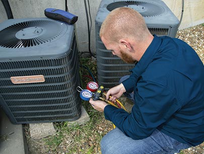 Man Inspecting Outside Hvac House