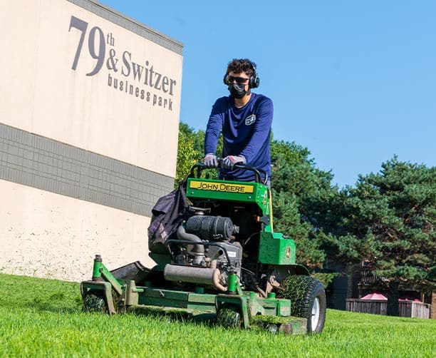 Man Using Riding Lawn Mower