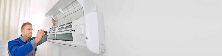 indoor AC repair being performed by a technician