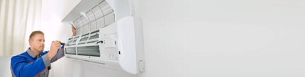 indoor AC repair being performed by a technician